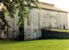 This 1890 bank barn has an unusual roof, giving it a unique appearance.