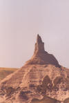 East of Scotts Bluff by about thirty miles is one of the enduring sights for the travelers on the Oregon Trail - Chimney Rock.  When the “Chimney” was sighted, one knew the plains were over and the scenery would soon be changing.  The “Chimney” is starting to lose out to nature, just like all rock formations.  It is now considerably shorter than when the folks were on the Oregon Trail.  Another rock also losing the battle with nature is Registry Cliff outside Guernsey, WY.  Registry Cliff is where the travelers on the trail carved their names and messages into a cliff to pass information on to following wagon trains.